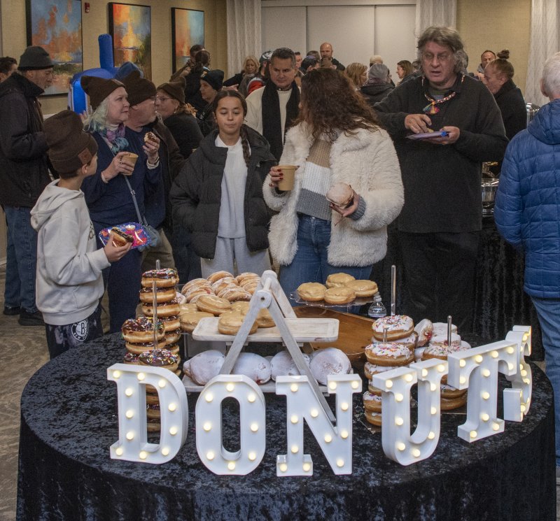 Donuts are a big hit at the menorah lighting celebration.
